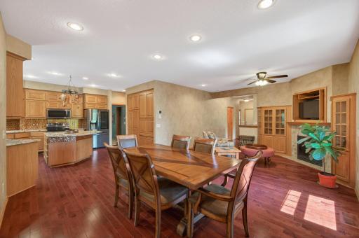 The heart of the home features an open-concept design that seamlessly connects the kitchen, dining area, and great room.