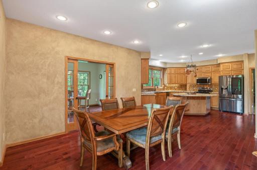 The spacious dining area easily accommodates large gatherings, while the open layout allows guests and family to stay connected throughout the space