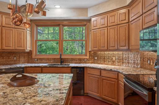 Thoughtfully designed with abundant storage, custom woodwork, and plenty of natural light, this beautiful kitchen area offers both elegance and functionality.