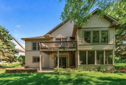 Enjoy multiple outdoor living areas, including an elevated deck, screened porch, walkout patio, and beautifully landscaped yard, all designed to maximize the peaceful wooded views.
