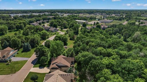 Situated on a premium lot adjacent to a wooded-out lot that is planned to remain undeveloped