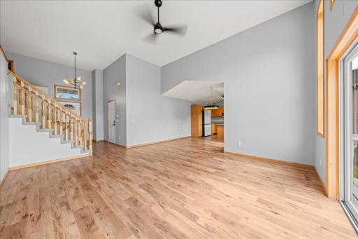 Additional view of living room looking towards dining area and kitchen