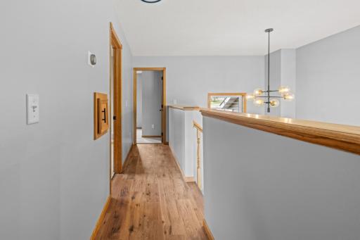 Upper level hallway leading to 2 additional bedrooms