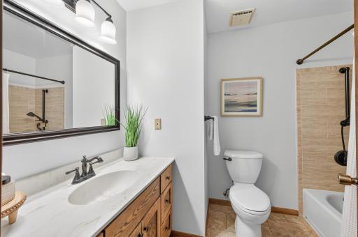 Beautiful tile details and spacious countertops make this bathroom both practical and easy to enjoy.