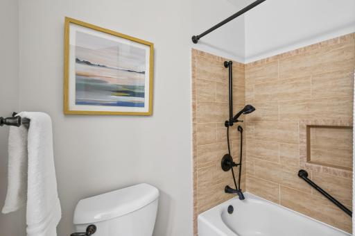 Clean and functional, this bathroom includes a shower/tub and all the essentials for daily living.