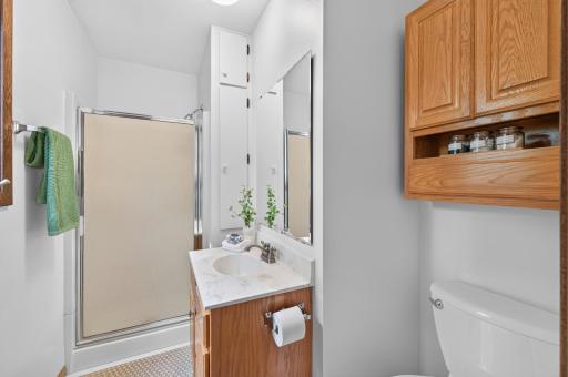 This well-appointed ensuite bathroom provides a private retreat just steps from the primary bedroom, designed for comfort and convenience.