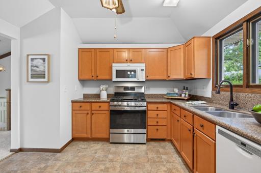 This kitchen offers ample workspace, abundant storage, and a functional layout perfect for everyday living and entertaining.