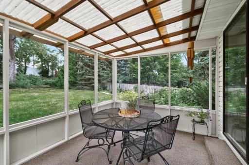 Whether you're enjoying your morning coffee or an evening breeze, this spacious screened porch is the perfect place to relax and recharge. Picture taken earlier in spring to show different options.