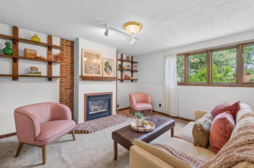 This finished basement combines comfort and function, highlighted by a gas fireplace that adds warmth and charm year-round.