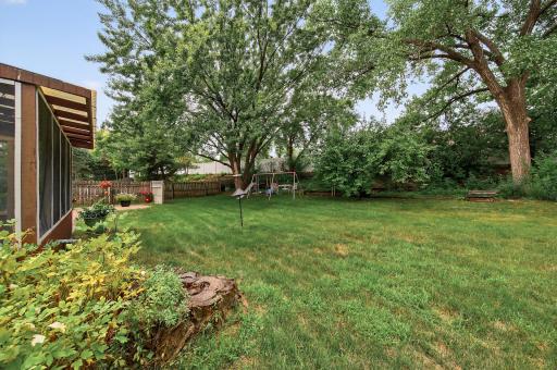 large fenced in backyard offering plenty of room to relax, entertain, garden, or enjoy outdoor activities in a private setting