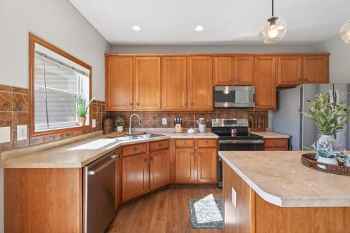 Functional kitchen layout with abundant counter space and pantry access.