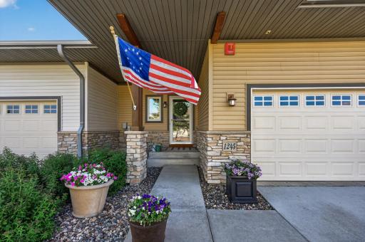 Covered Entry with stone accents and lovely curb appeal