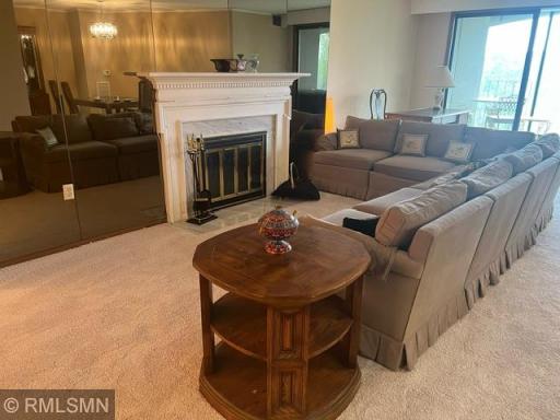 Living Room with cozy seating around fireplace.