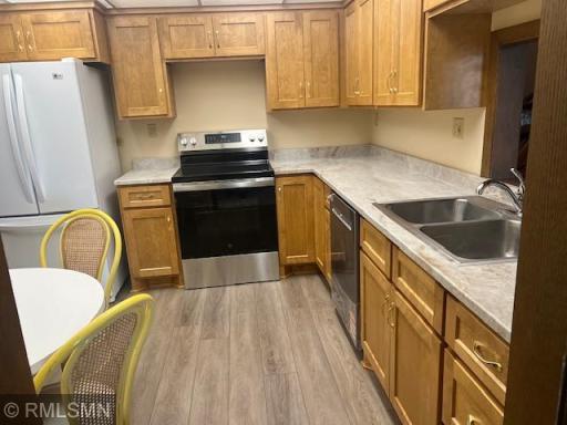 Newly updated kitchen with custom cupboards, counter-tops, appliances and flooring.