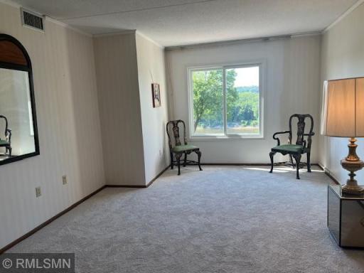 Spacious Master Bedroom with River View adjoins private 3/4 bath and walk-in closet.