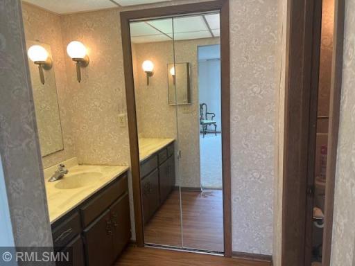 Private 3/4 master bath, with large walk-in closet through folding mirrored doors.