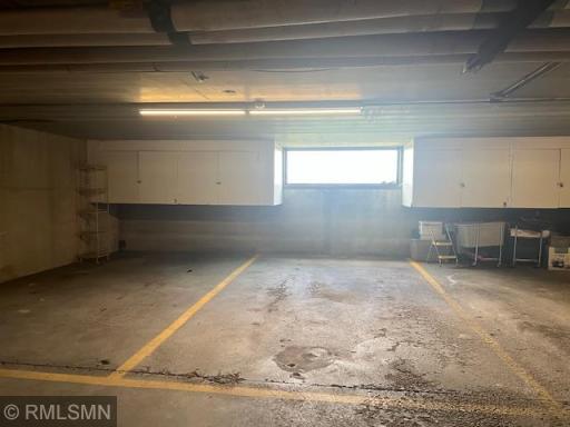 Two adjacent Garage Stalls, #3 and #4 with storage and window.