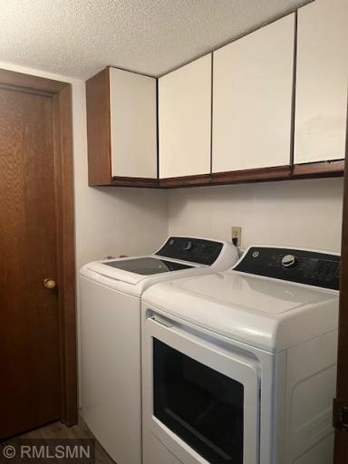 Laundry with brand new GE Washer and Dryer. Adjacent storage closet.
