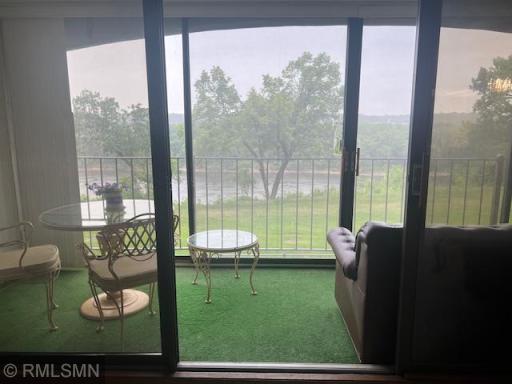 Relax on the Three-Season Porch/Balcony with a cool cold beverage and enjoy the view.