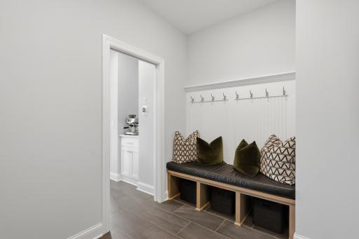 Entry off the garage w/ built in bench