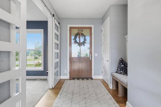 A welcoming entrance with extra wide door and large window
