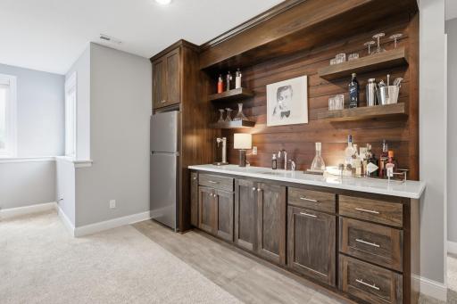 Gorgeous wet bar on lower level with brand new fridge just put in