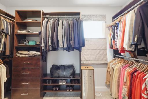 Large primary closet with mutiple buit ins, shelves, drawers, etc. These custom luxury drapes will stay with the house.