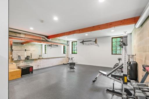 Home gym with mirrored walls and radiant in-floor heating (gym equipment can stay with the home)