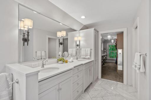 Ensuite bathroom with radiant in floor heating, dual sinks and water closet