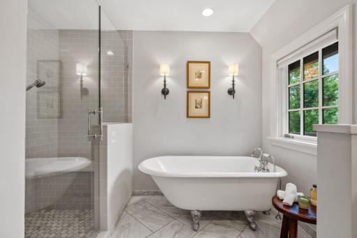 Spacious walk in shower with claw foot tub