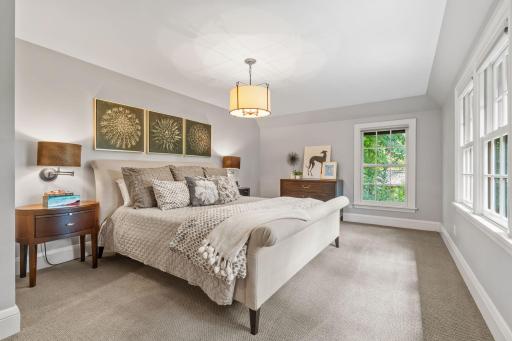 Light filled primary bedroom with a stunning view of Interlachen Golf Course