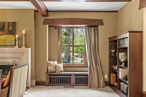Original built-in window bench with detailing that reflects the craftsmanship of the dining room doors