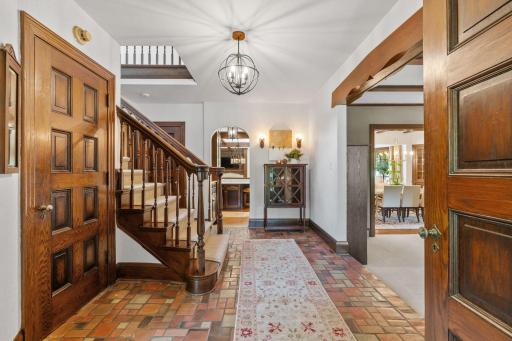 Foyer with original stone flooring and three closets