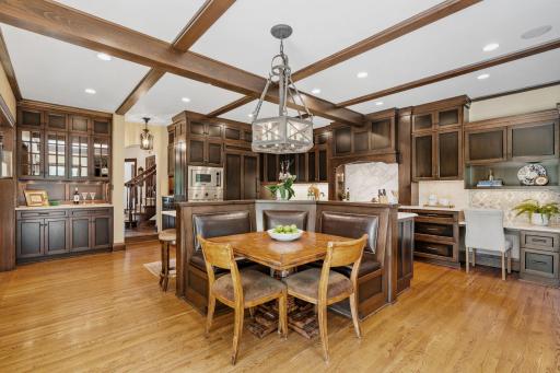 Built-in seating with thoughtful custom woodwork details echoing the home's original craftsmanship