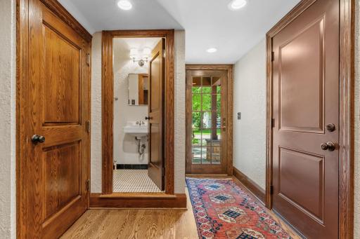 Powder room off the mudroom with original basket weave tile floor