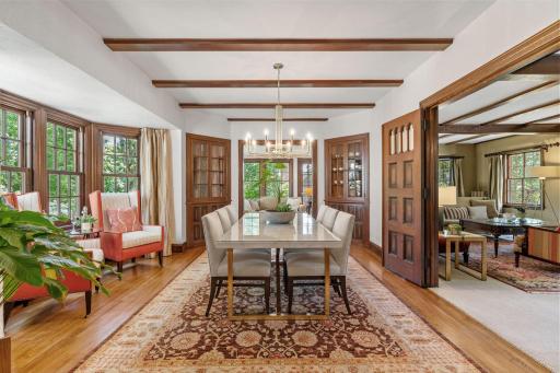 Formal dining room with hardwood floors and built-in cabinetry and bay window