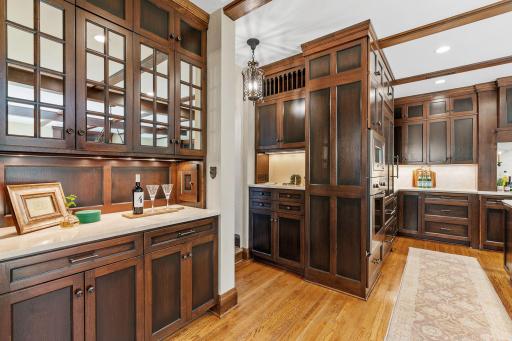 Thoughtfully designed cabinetry with architectural detailing that reflects the home's original woodwork