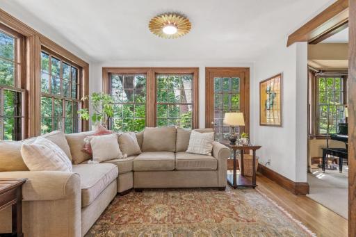 Sunroom with windows on all sides allow for light-filled views of nature
