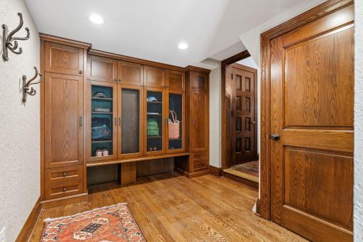 Large mudroom with built in storage for seasonal gear and access to the front yard