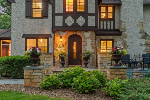 Welcoming front entrance with Fond Du Lac pillars and self-watering planters
