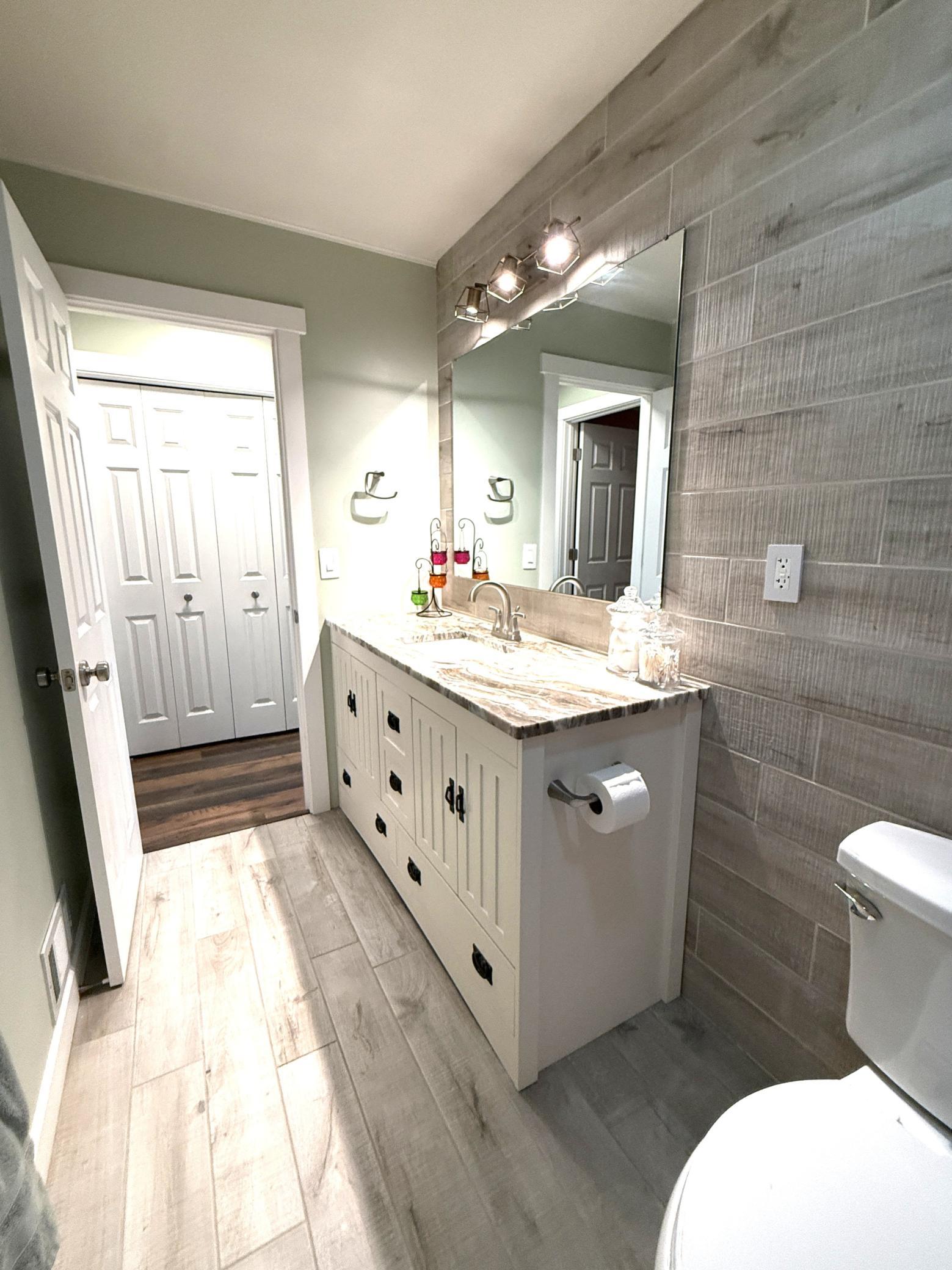 Lower-level bathroom with walk-in shower.
