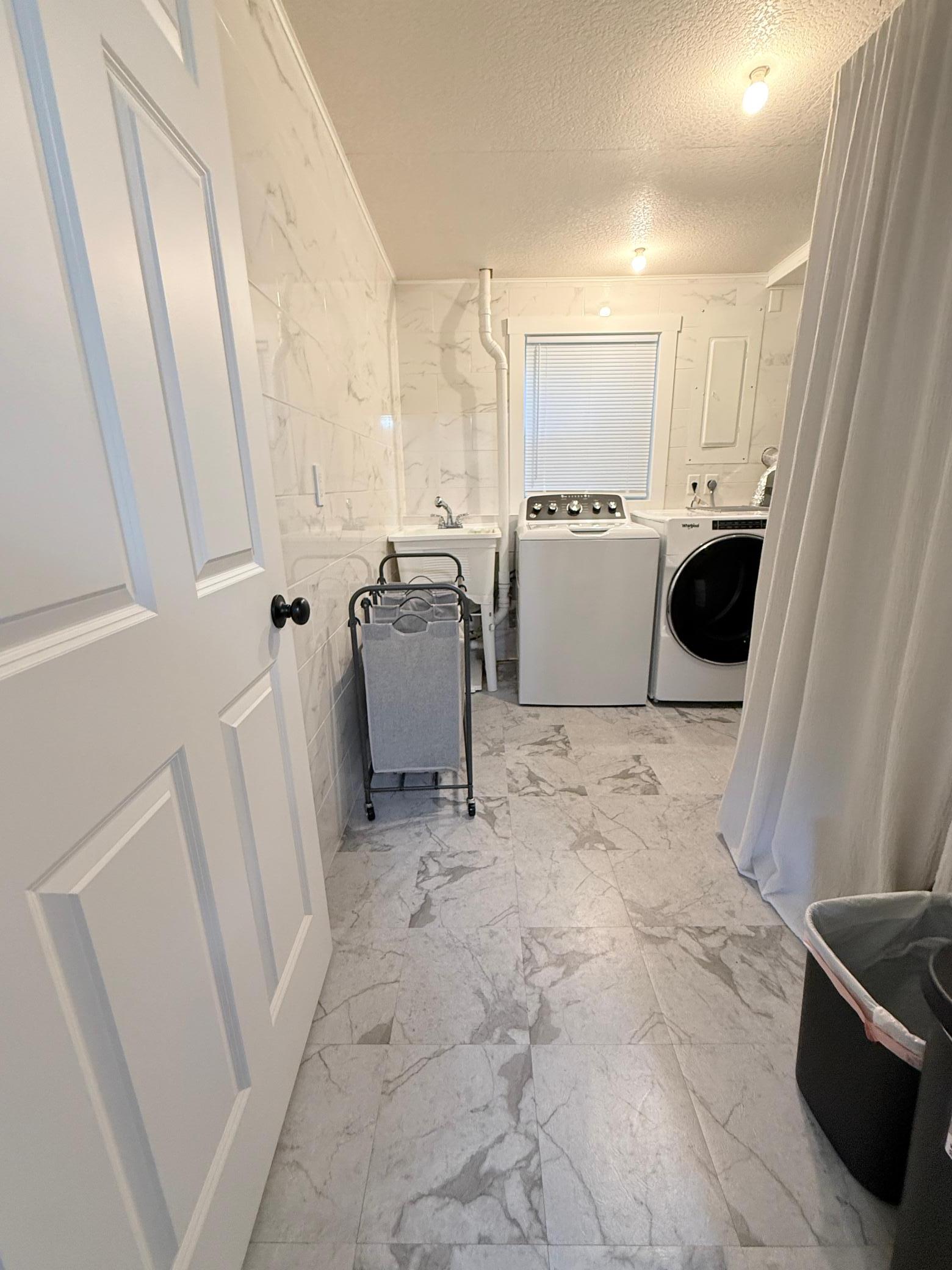 Laundry and mechanical room. Water softener owned, furnace replaced in 2021