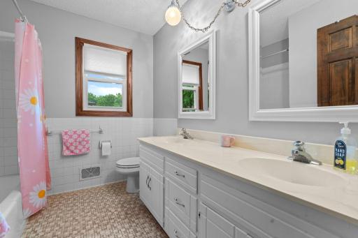 Full upper bathroom features double sinks!