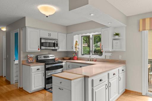 Abundance of cabinetry and kitchen window.