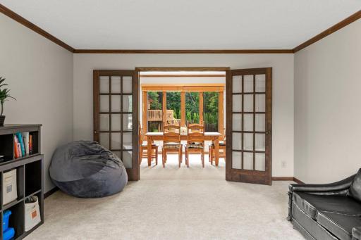 French doors to dining and office spaces.