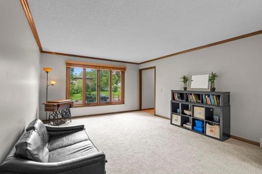Large living room with new carpet and paint.