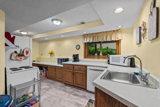 Versatile basement perfectly setup for multi-generational living. Fully finished walkout lower level features a second kitchen, creating an opportunity for an in-law suite, private living quarters, or the ultimate entertaining or hosting space.