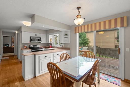 Informal dining nook walks out to backyard deck.