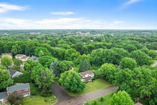 Nestled on a beautiful corner lot in the highly sought-after Wayzata School District, this spacious 5-bedroom, 4-bathroom Plymouth home. Move in ready with fresh paint, finished walkout basement with 2nd kitchen.