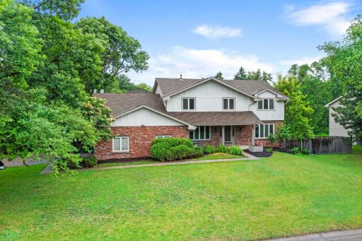 Rare opportunity in highly sought-after Wayzata School District! Situated on a beautiful corner lot, this spacious 5-bedroom, 4-bath Plymouth home features a finished walkout lower level and an versatile floor plan setup for multi-generational living